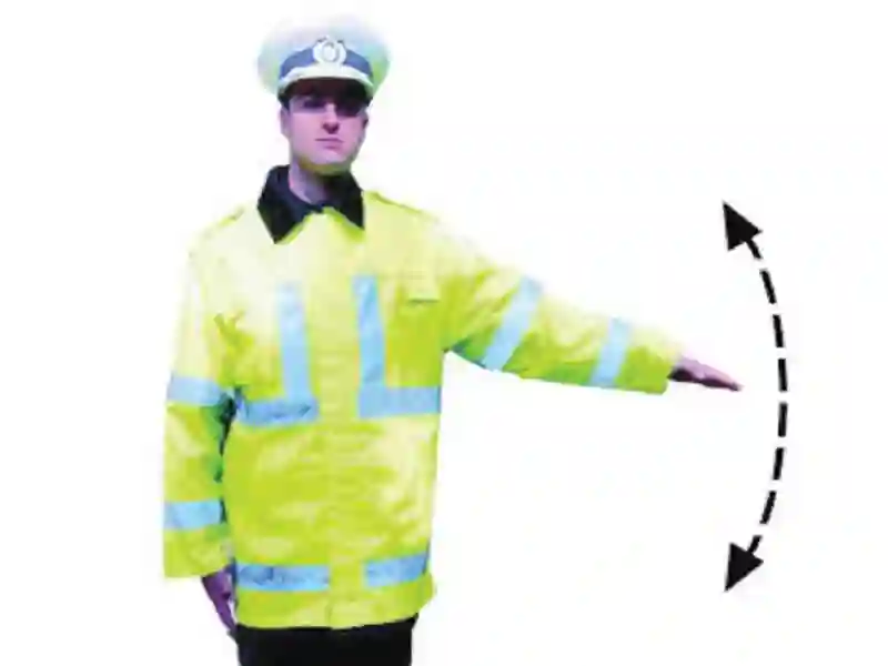 Imagine întrebare examen auto: Ce indică semnalul polițistului?