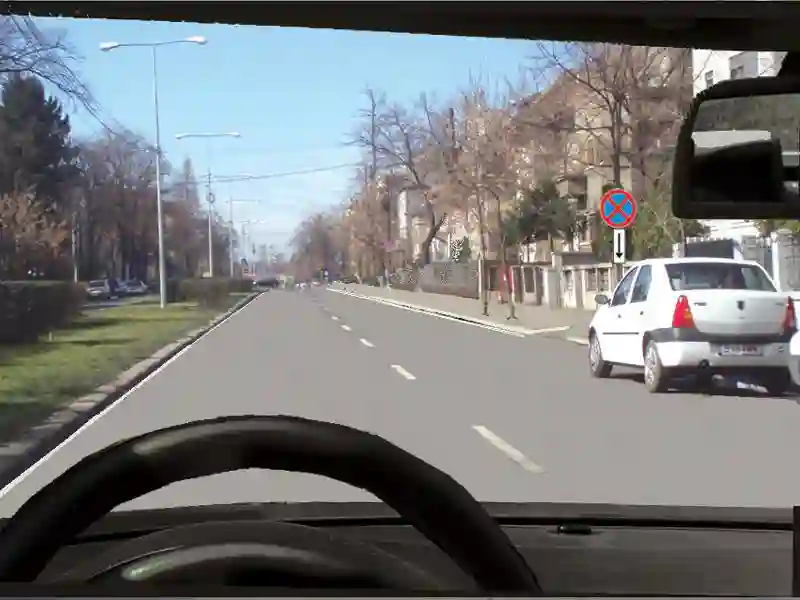 Imagine întrebare examen auto: Autoturismul alb din dreapta dvs. a oprit regulamentar?